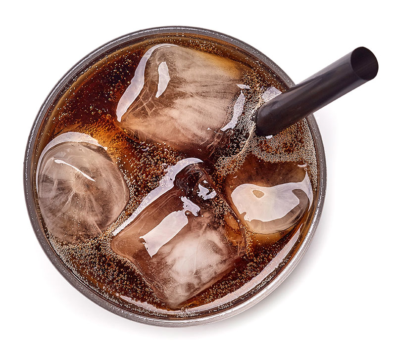 top-down shot of a glass of cola