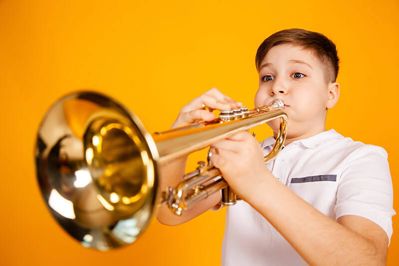 boy playing a trombone